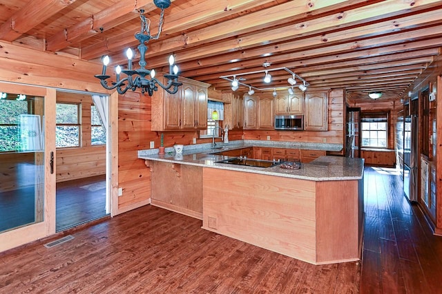 kitchen featuring wooden ceiling, black electric cooktop, dark hardwood / wood-style floors, kitchen peninsula, and beam ceiling