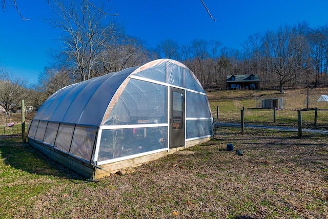 view of outbuilding featuring a yard