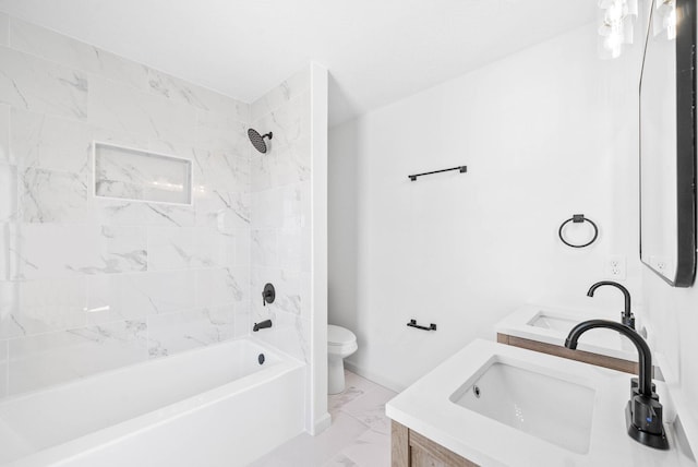 full bathroom with tiled shower / bath combo, vanity, and toilet