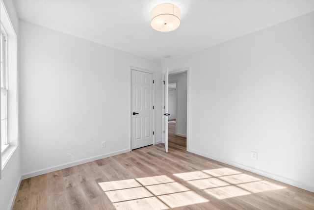 spare room with light wood-type flooring