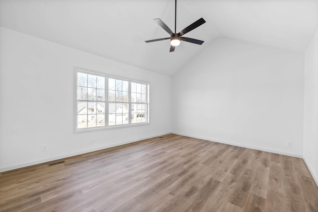 unfurnished room featuring ceiling fan, lofted ceiling, and light hardwood / wood-style flooring