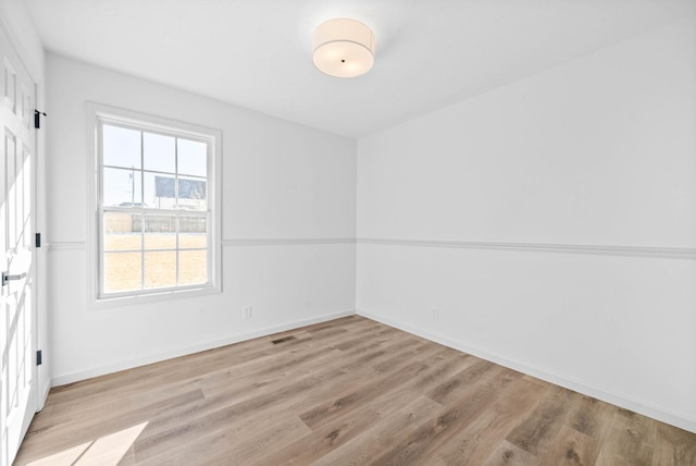 spare room with light wood-type flooring