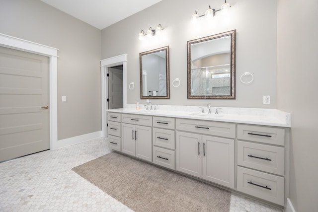 bathroom with tile patterned floors and vanity