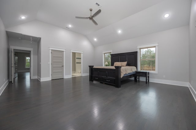 bedroom with dark wood-type flooring, ensuite bath, vaulted ceiling, and ceiling fan