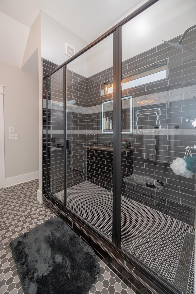 interior space featuring a shower with shower door