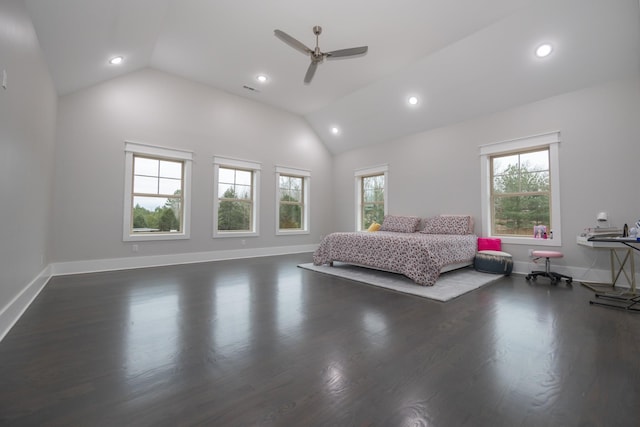 unfurnished bedroom featuring vaulted ceiling, dark hardwood / wood-style floors, and ceiling fan