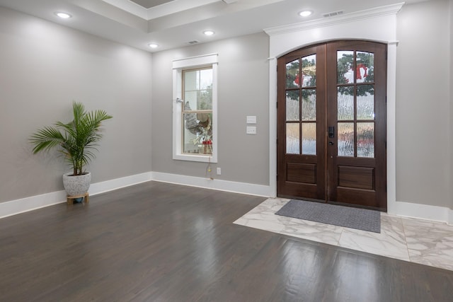 entrance foyer featuring french doors and ornamental molding