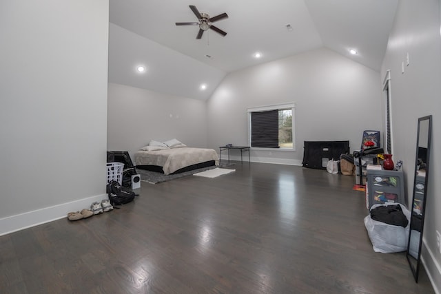 bedroom with ceiling fan, dark hardwood / wood-style floors, and high vaulted ceiling