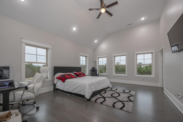 bedroom featuring dark hardwood / wood-style flooring, high vaulted ceiling, and ceiling fan