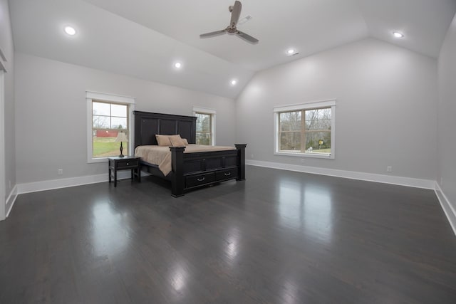 bedroom with lofted ceiling, dark hardwood / wood-style floors, and ceiling fan