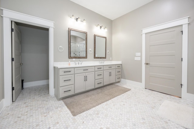 bathroom with tile patterned flooring and vanity