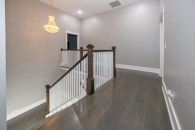 corridor featuring dark hardwood / wood-style floors