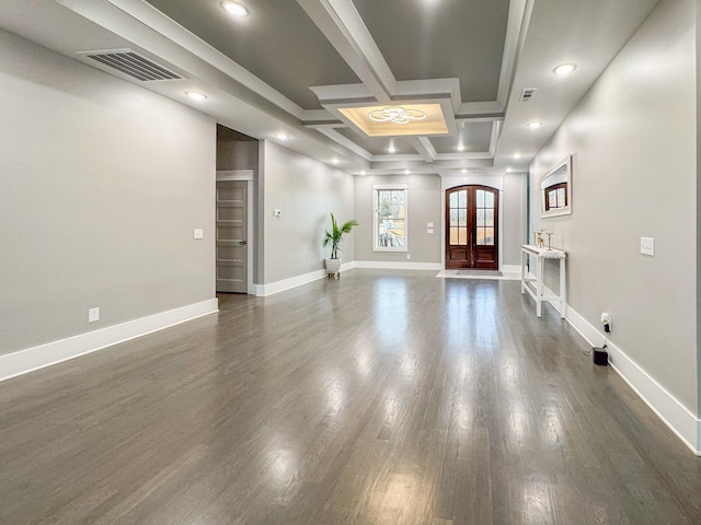 unfurnished room featuring french doors, coffered ceiling, dark wood-type flooring, and beam ceiling