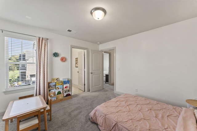 bedroom with light carpet