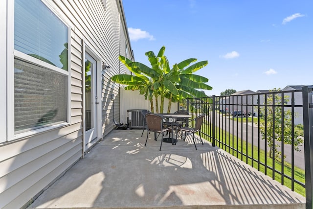 balcony with central AC unit and a patio area