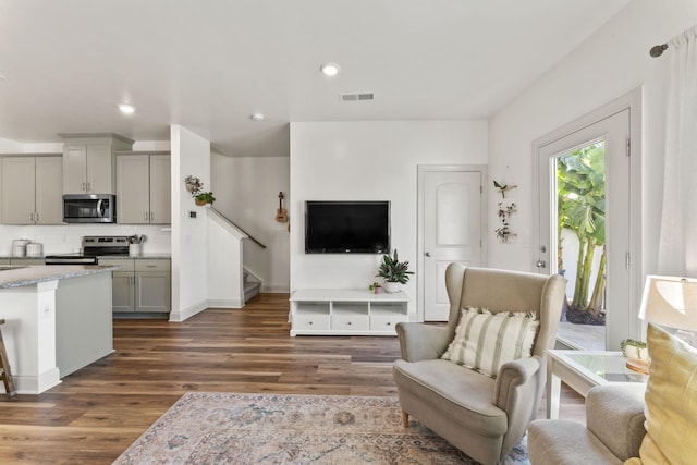 living room with dark hardwood / wood-style floors