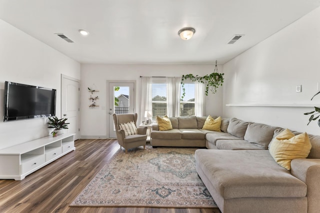 living room with dark hardwood / wood-style flooring