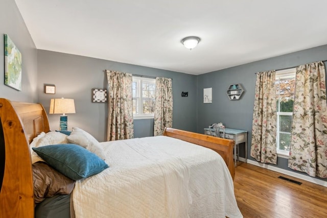 bedroom featuring wood-type flooring