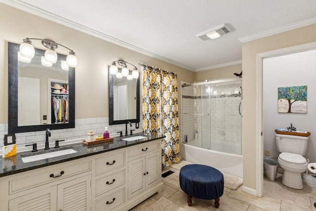 full bathroom with tiled shower / bath, tasteful backsplash, vanity, toilet, and crown molding