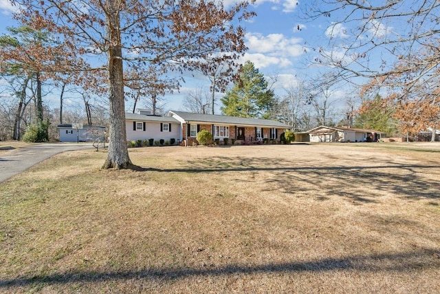 ranch-style house with a front lawn