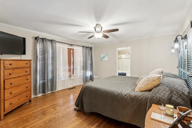 bedroom with connected bathroom, crown molding, light hardwood / wood-style floors, and ceiling fan