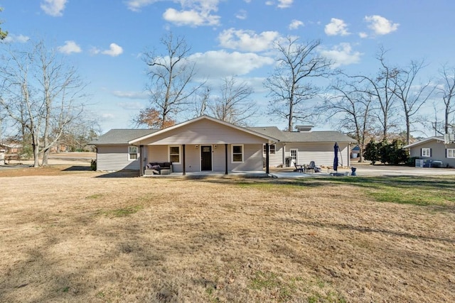 single story home featuring a patio and a front yard