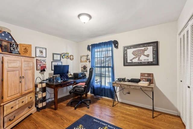 office space with hardwood / wood-style flooring