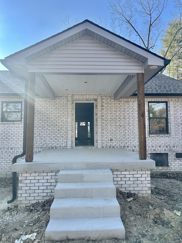 property entrance featuring covered porch