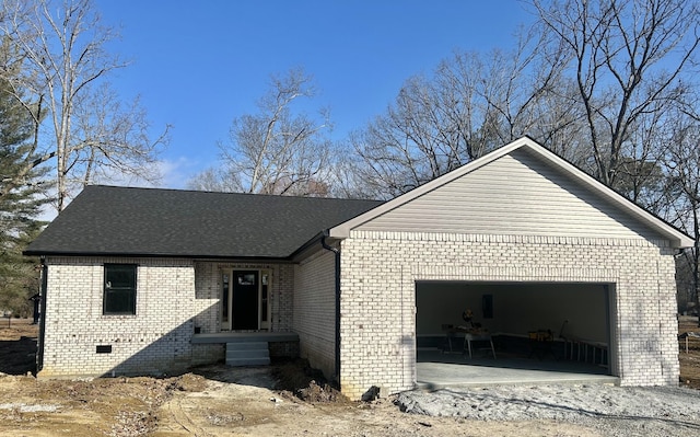 view of side of property with a garage