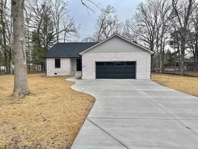 view of front of house with brick siding, concrete driveway, and an attached garage