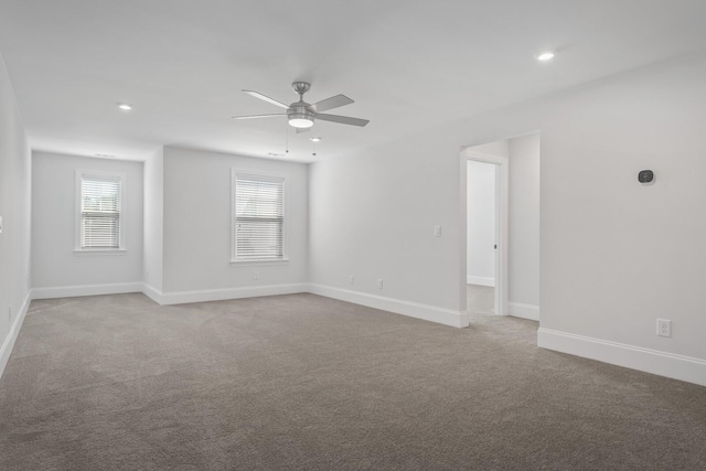 unfurnished room with light carpet and ceiling fan