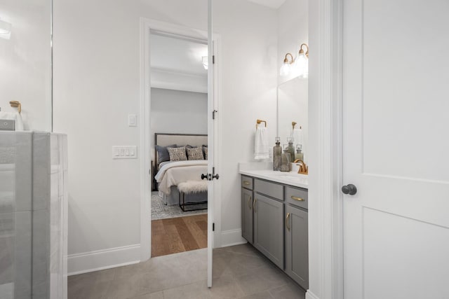 bathroom featuring tile patterned flooring, vanity, and an enclosed shower