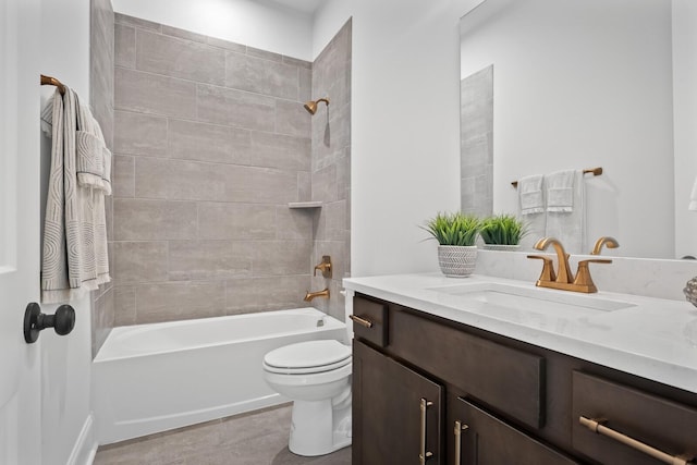 full bathroom with tiled shower / bath, vanity, and toilet