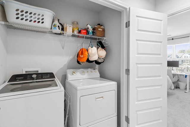 laundry area featuring separate washer and dryer and carpet