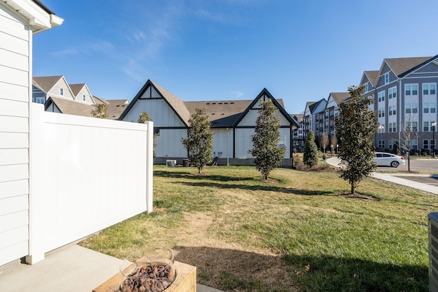 view of yard with a fire pit