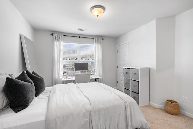 bedroom with light colored carpet