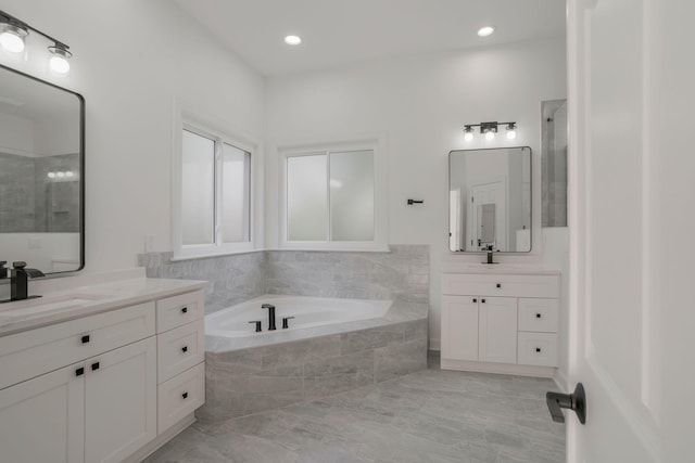 bathroom with vanity and plus walk in shower