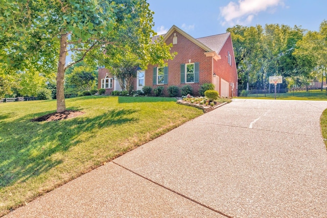 view of front of home featuring a garage and a front yard