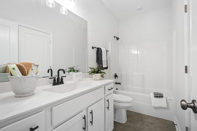 full bathroom featuring vanity, washtub / shower combination, and toilet