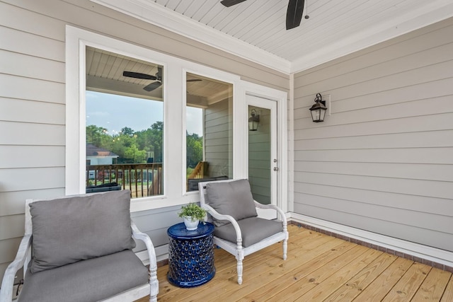 wooden terrace featuring ceiling fan