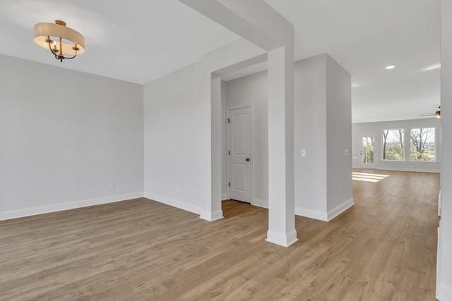 unfurnished room featuring ceiling fan and light wood-type flooring