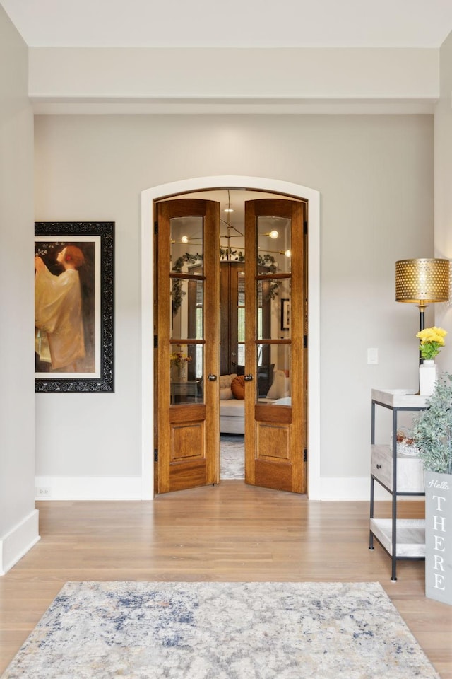 interior space featuring hardwood / wood-style floors and french doors