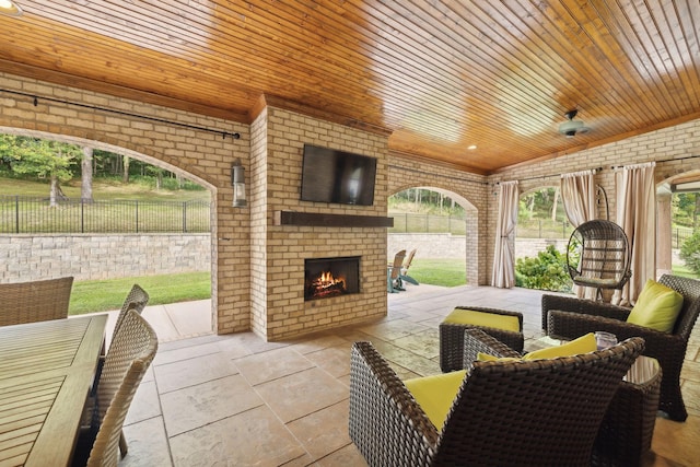 view of patio / terrace with an outdoor brick fireplace