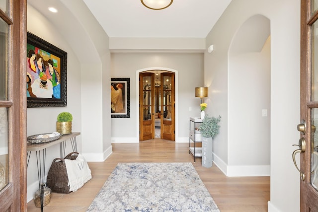 foyer with light hardwood / wood-style floors