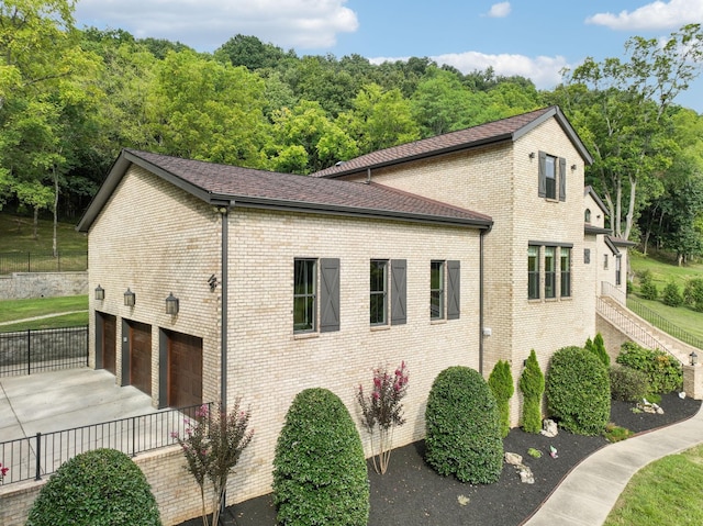 view of side of property with a garage