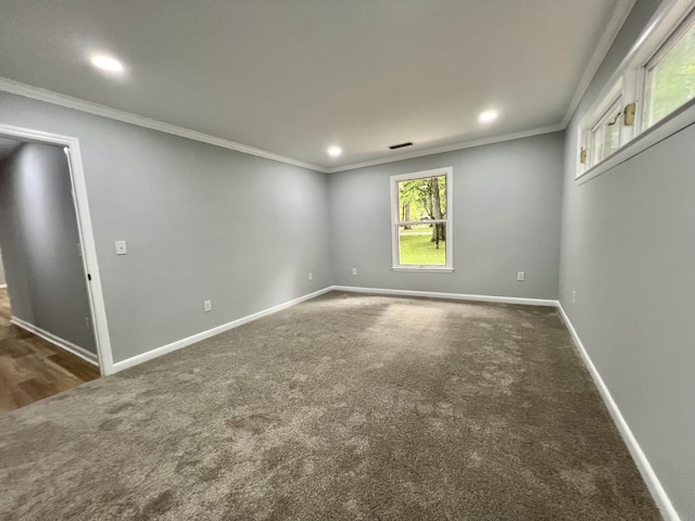 carpeted spare room with ornamental molding