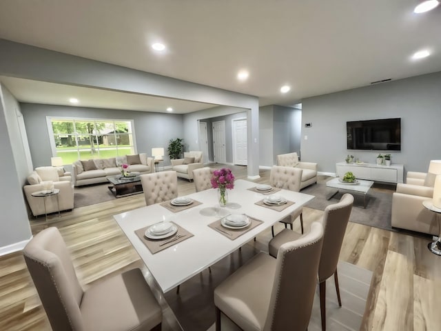 dining space featuring light wood-type flooring