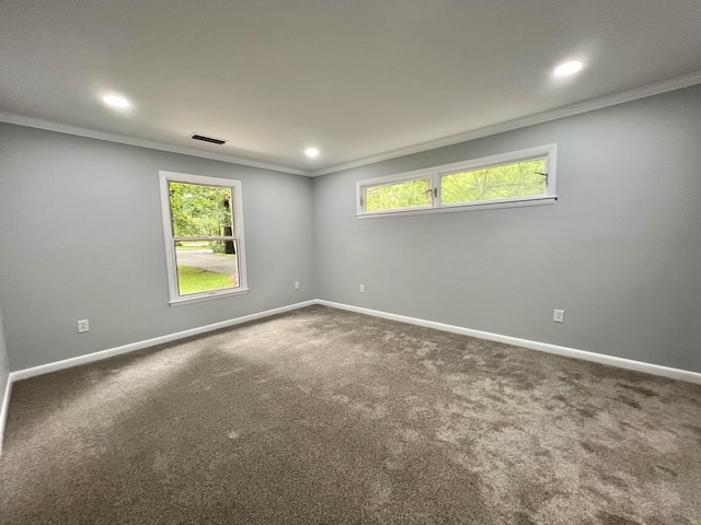 carpeted empty room with crown molding