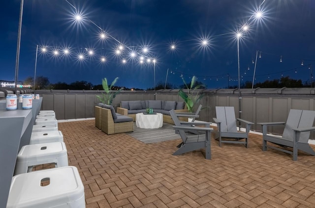 patio at night with outdoor lounge area