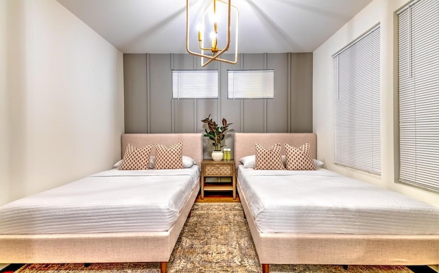 bedroom featuring a notable chandelier